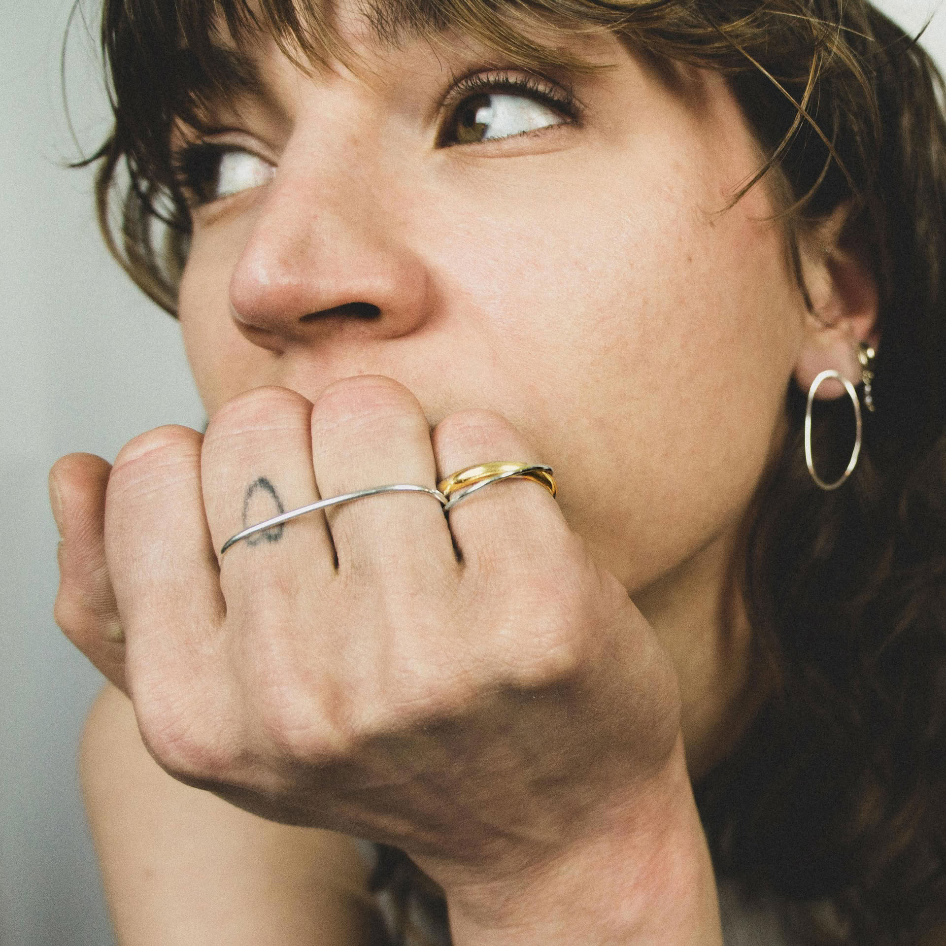 Hattari double finger ring with a mix of bands in sterling silver and gold plated silver