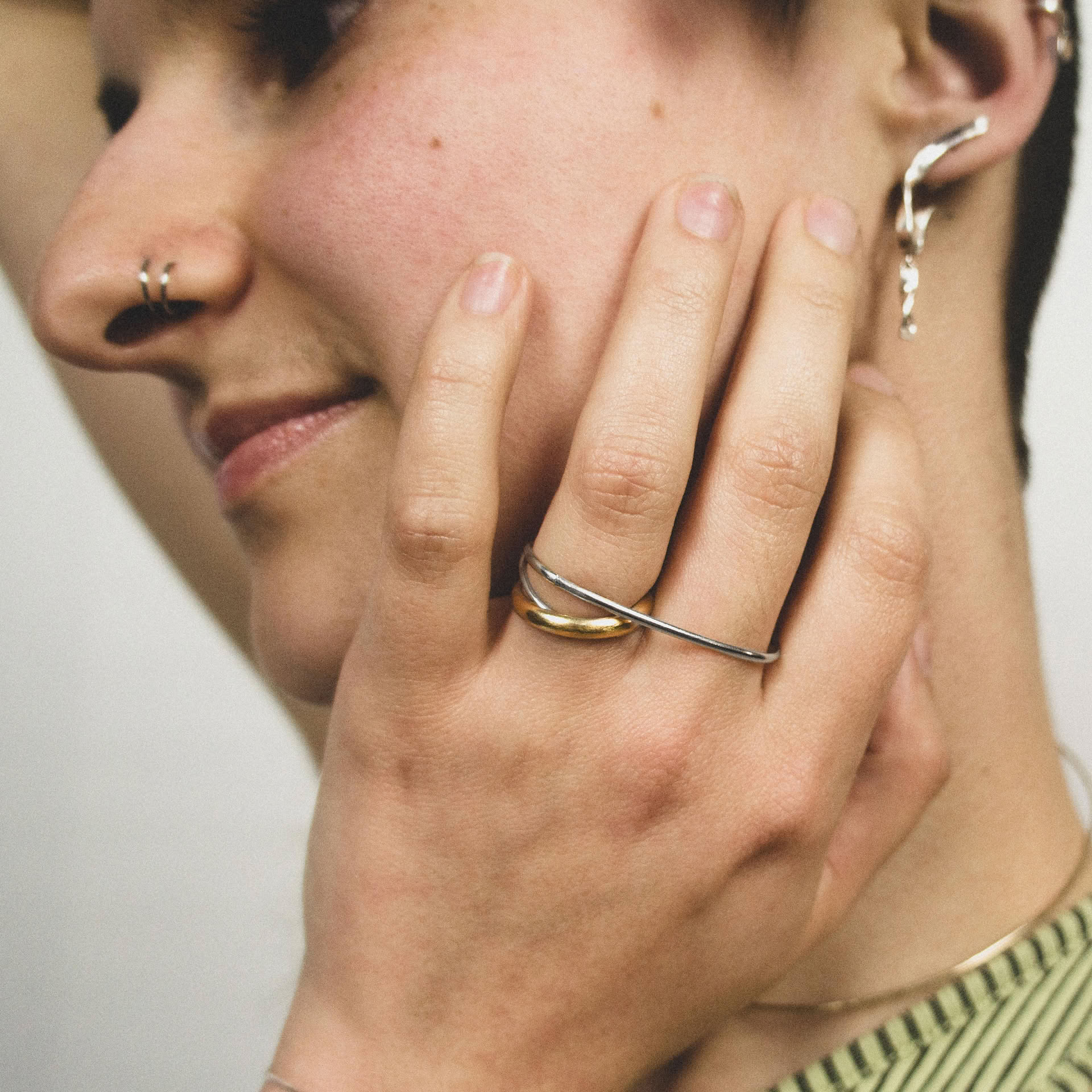 Hattari double finger ring with a mix of bands in sterling silver and gold plated silver