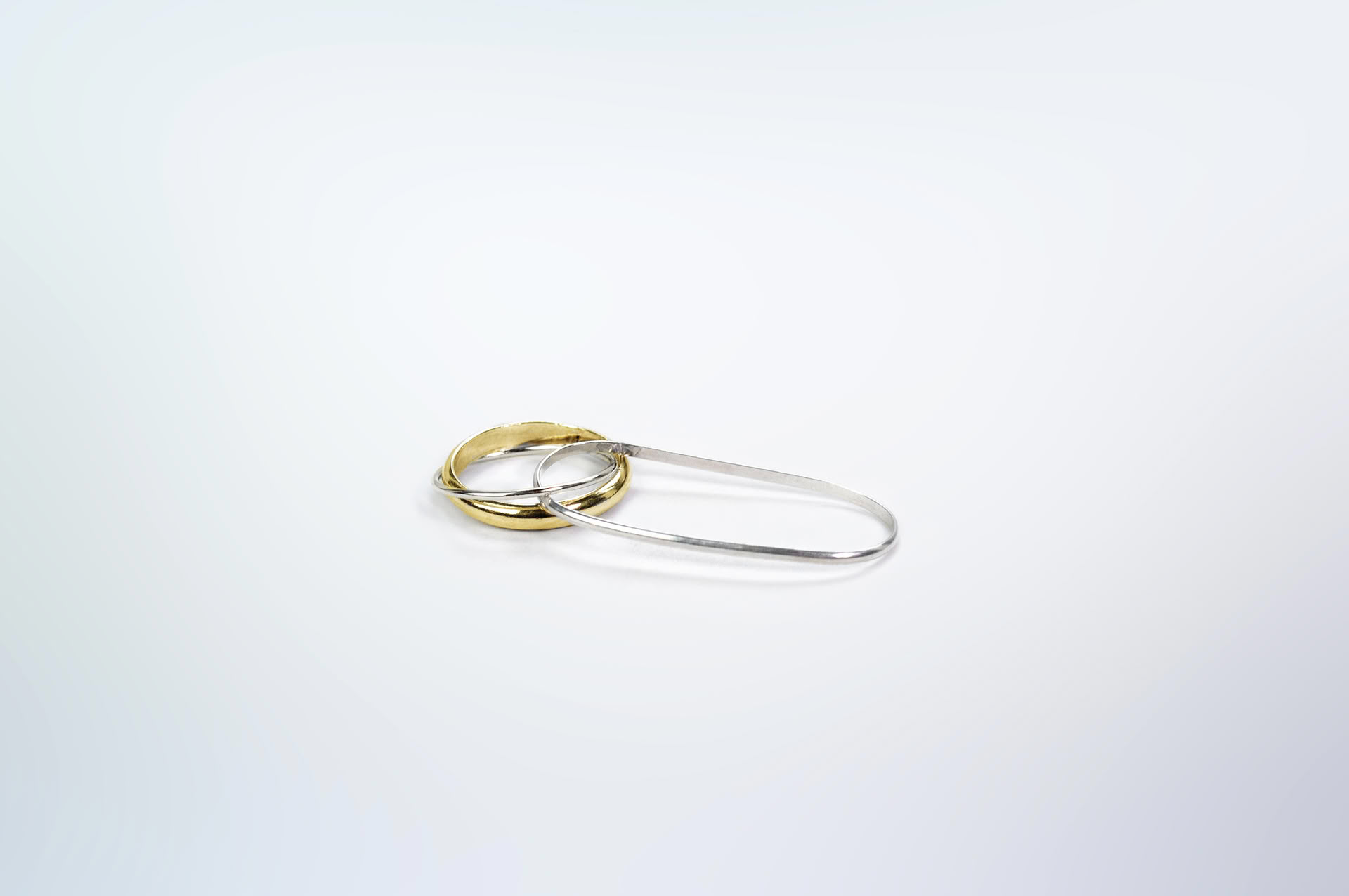 Hattari double finger ring with a mix of bands in sterling silver and gold plated silver