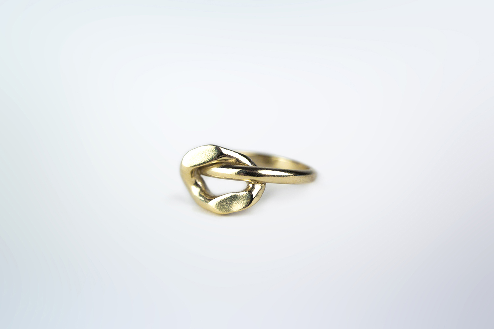 Ikkan gold plated silver ring with oversized link on top.