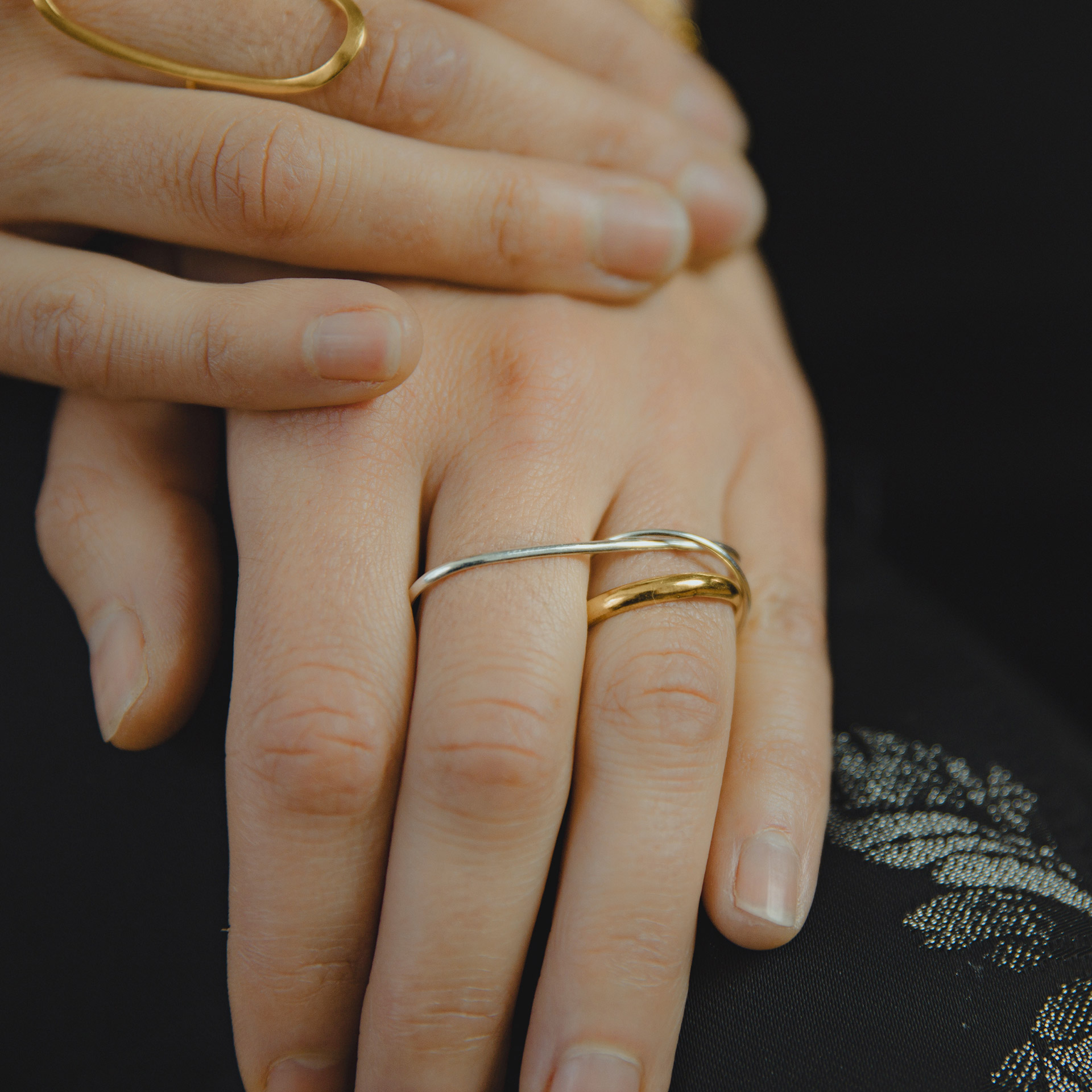 Hattari double finger ring with a mix of bands in sterling silver and gold plated silver.