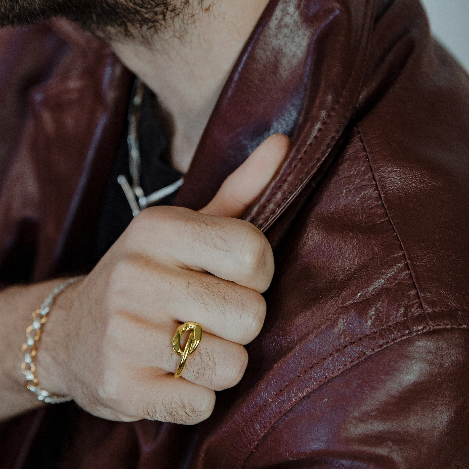 Ikkan gold plated silver ring with oversized link on top.