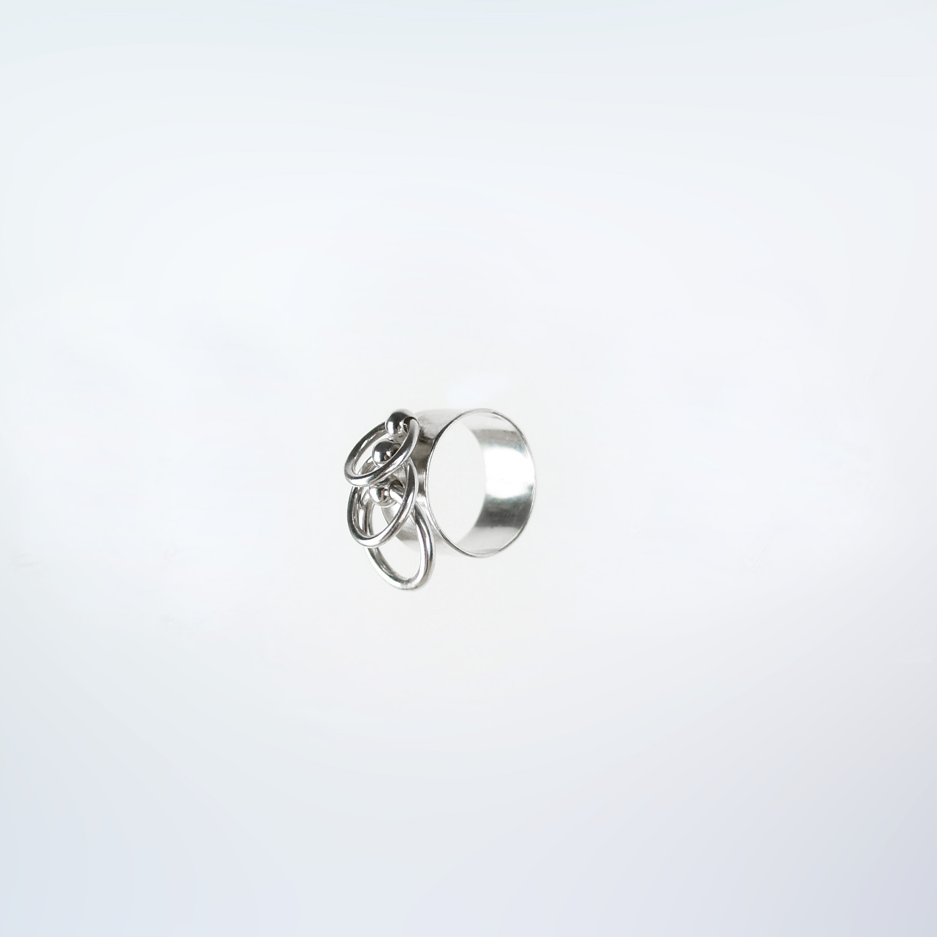 Piasu wide band silver ring with three hoops.