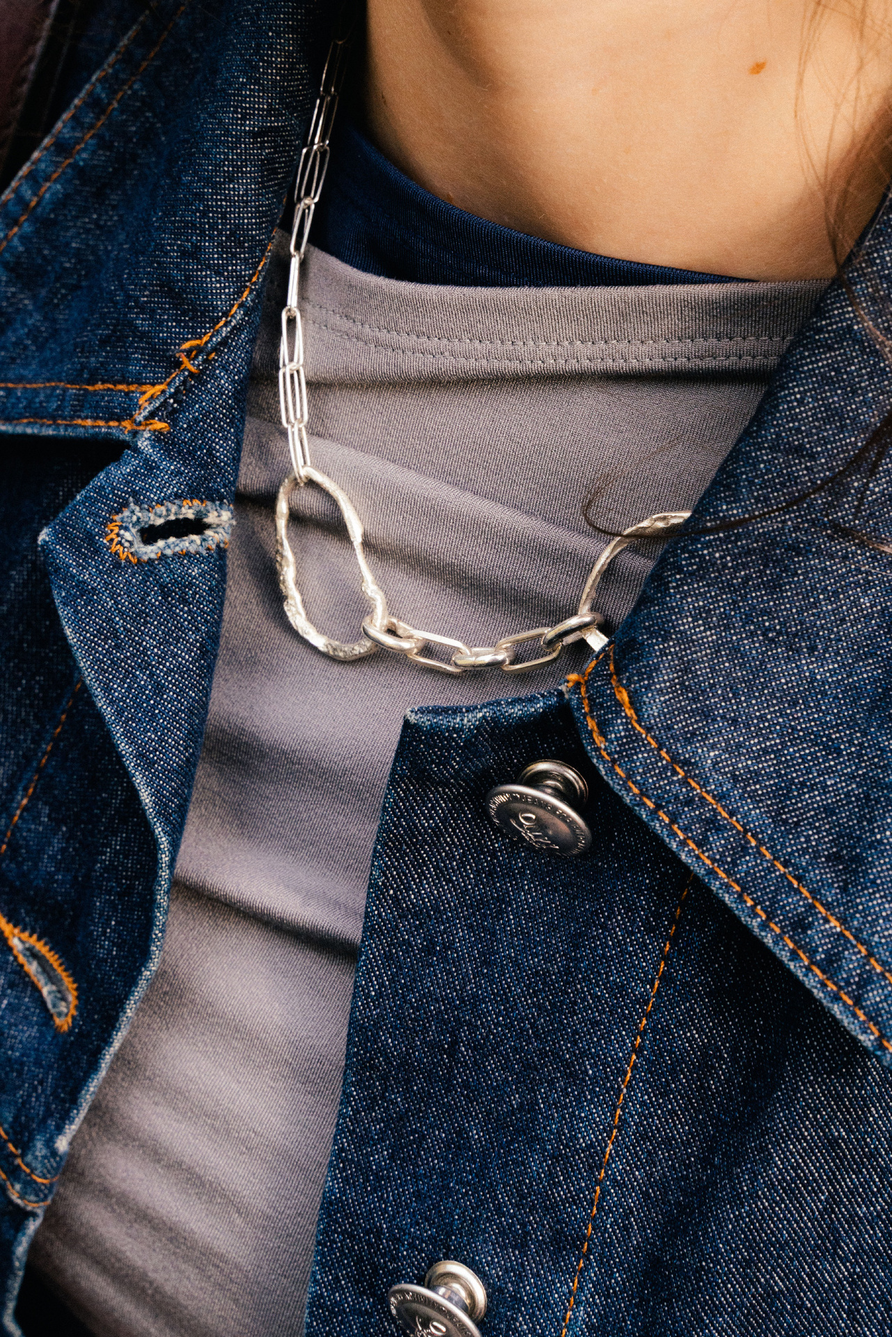 Fuyou sterling silver necklace with fluid elements and gold plated dangling detail.