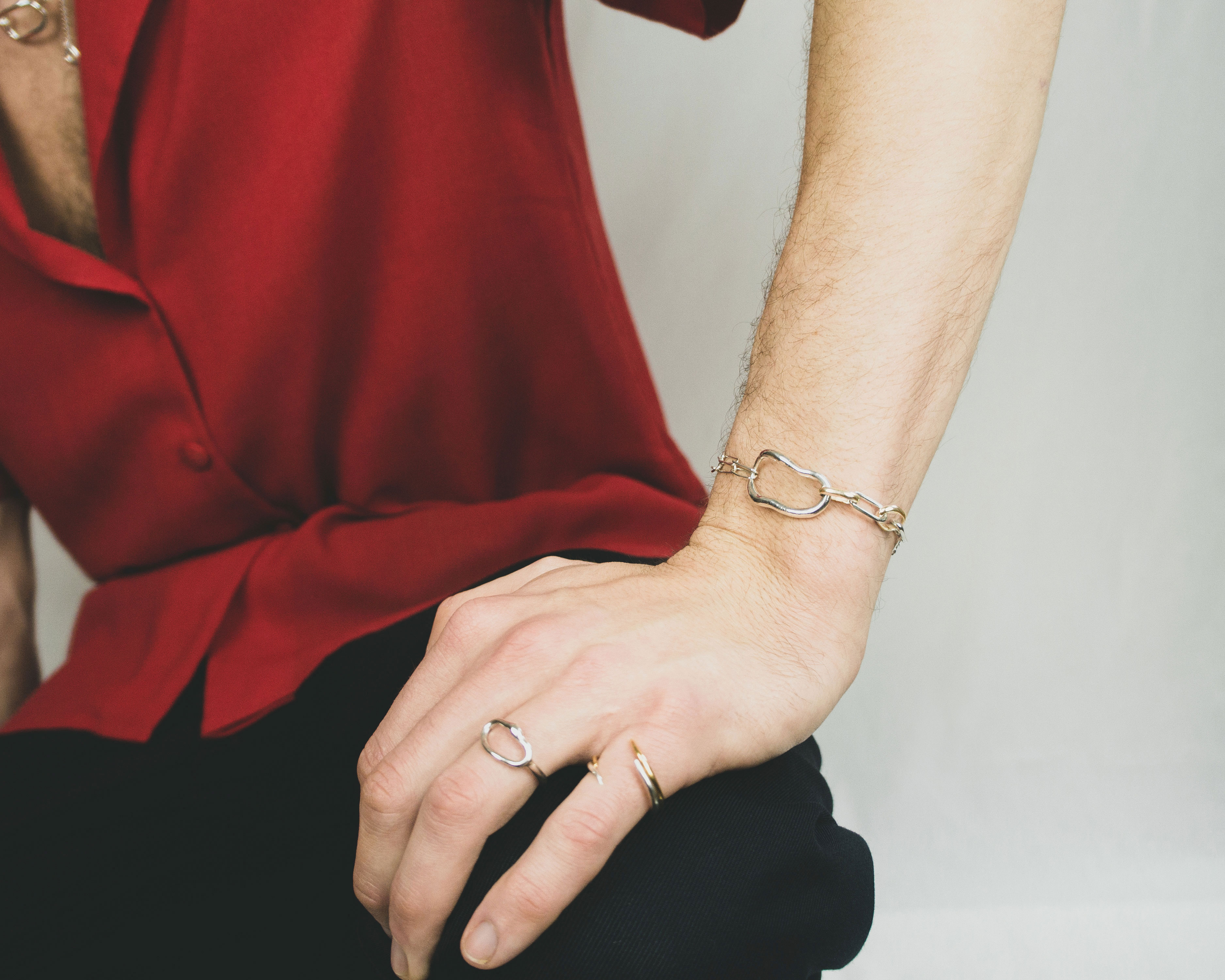 Fuyou sterling silver chain bracelet with fluid element and gold plated details.