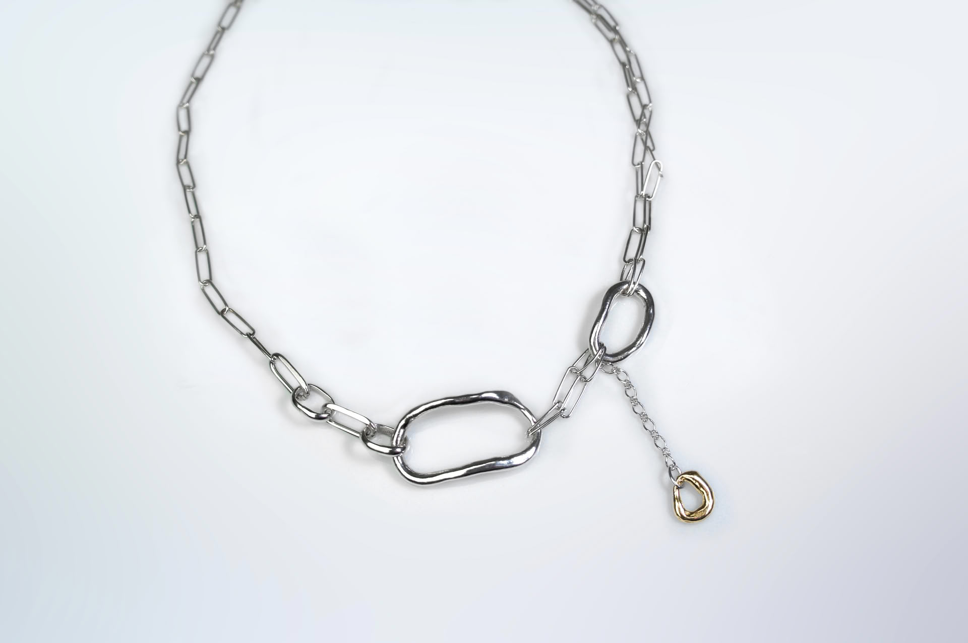 Fuyou sterling silver necklace with rectangle trace chain and fluid elements, gold plated dangling detail