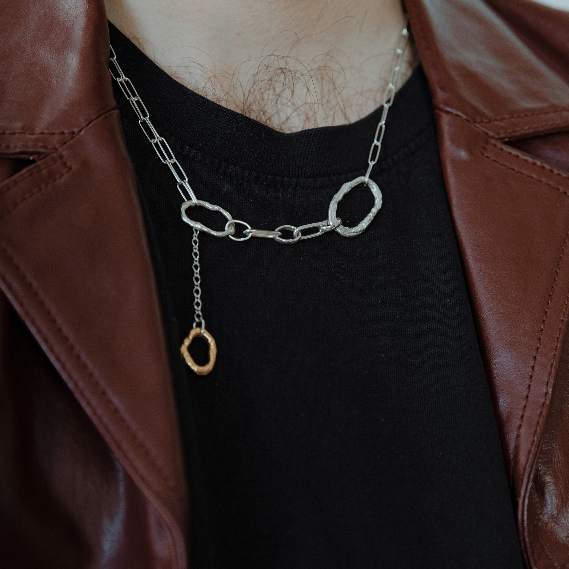 Fuyou sterling silver necklace with rectangle trace chain and fluid elements, gold plated dangling detail