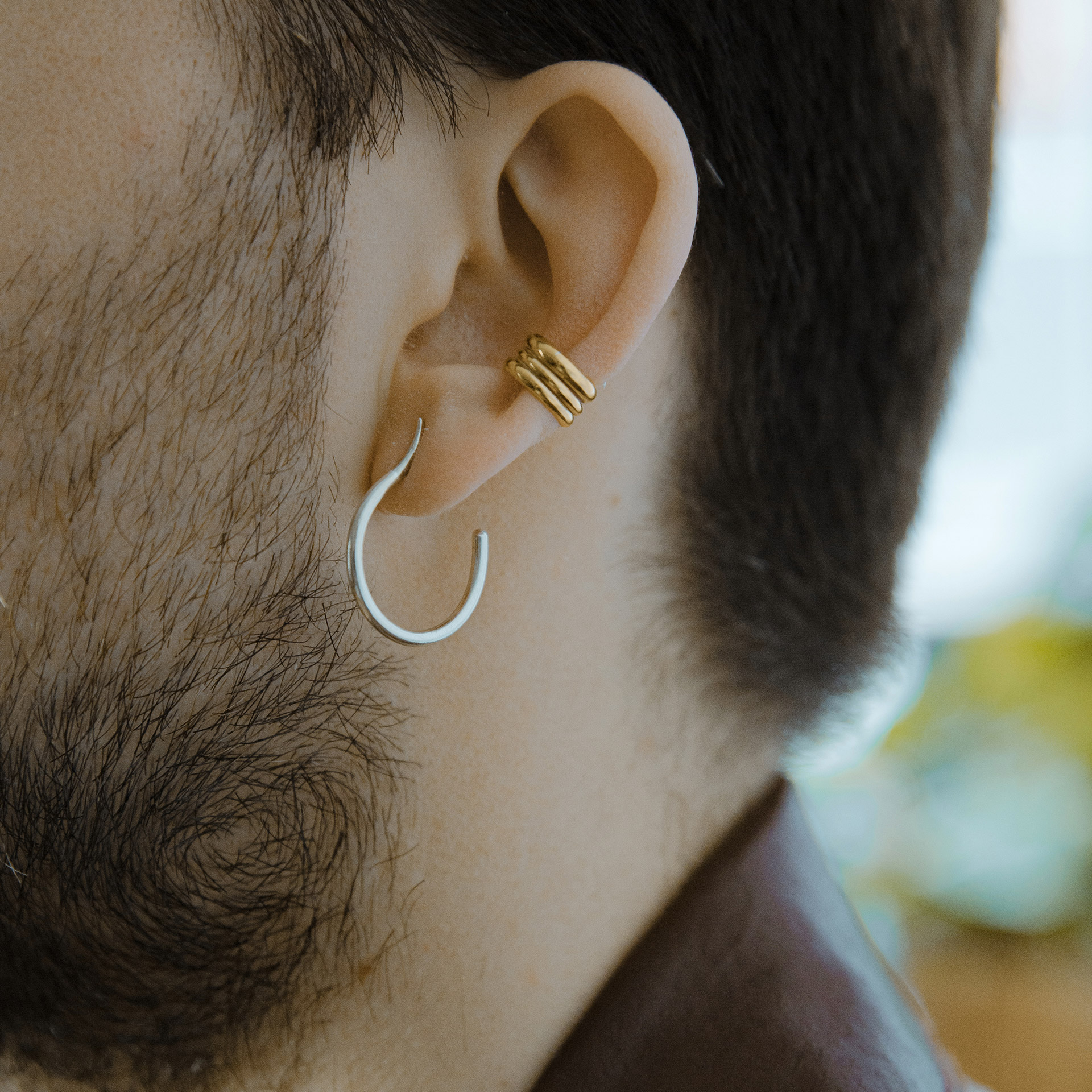 Mugura minimalist silver hoops.