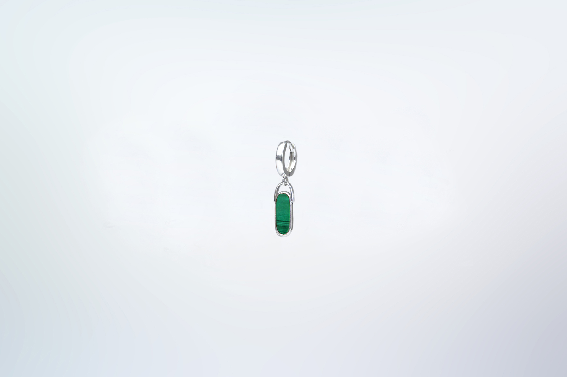 Rokku solo hoop earring in sterling silver with malachite stone.