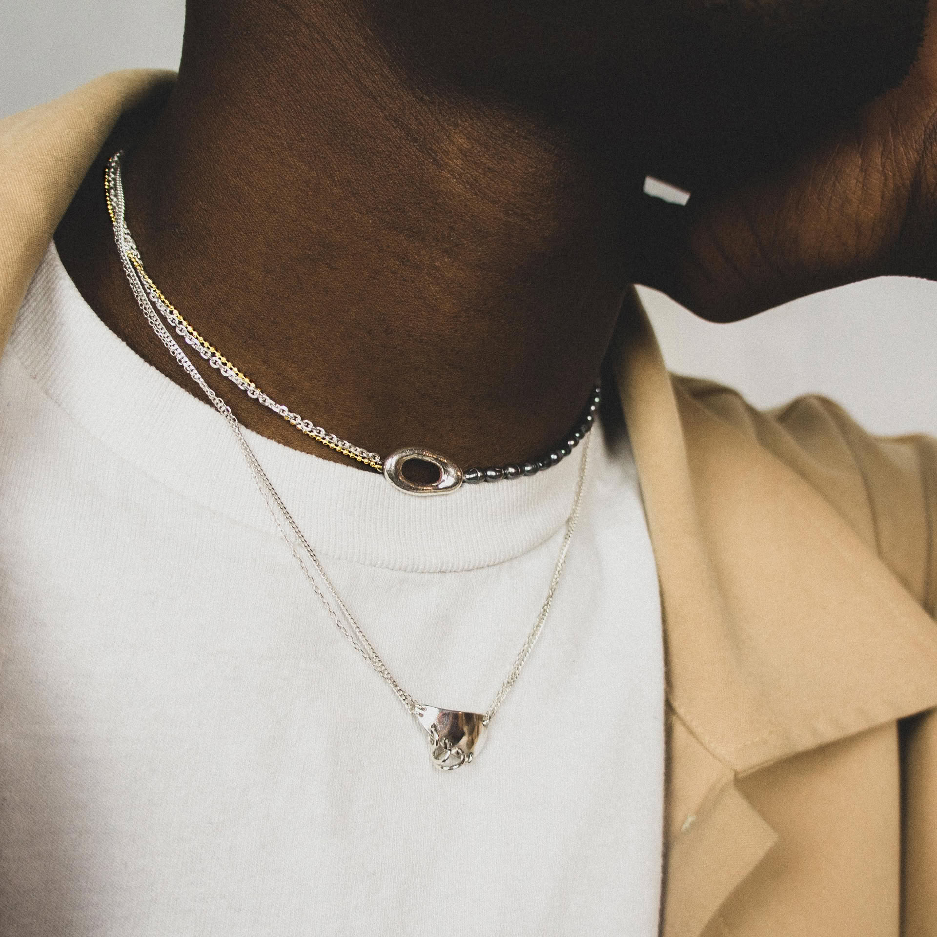 Tanemaki silver necklace with fresh water grey pearls and gold plated details