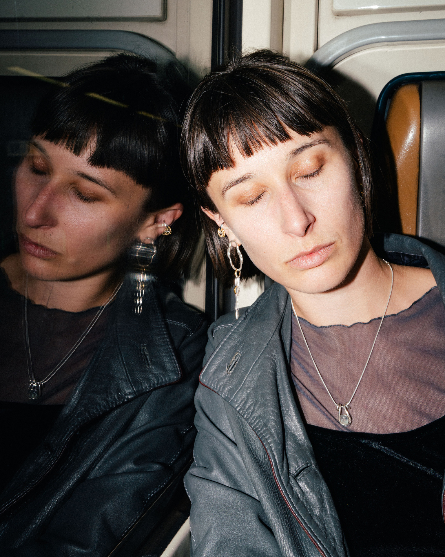 Fuyou long dangling earrings in silver with fluid oval shapes and gold plated details.