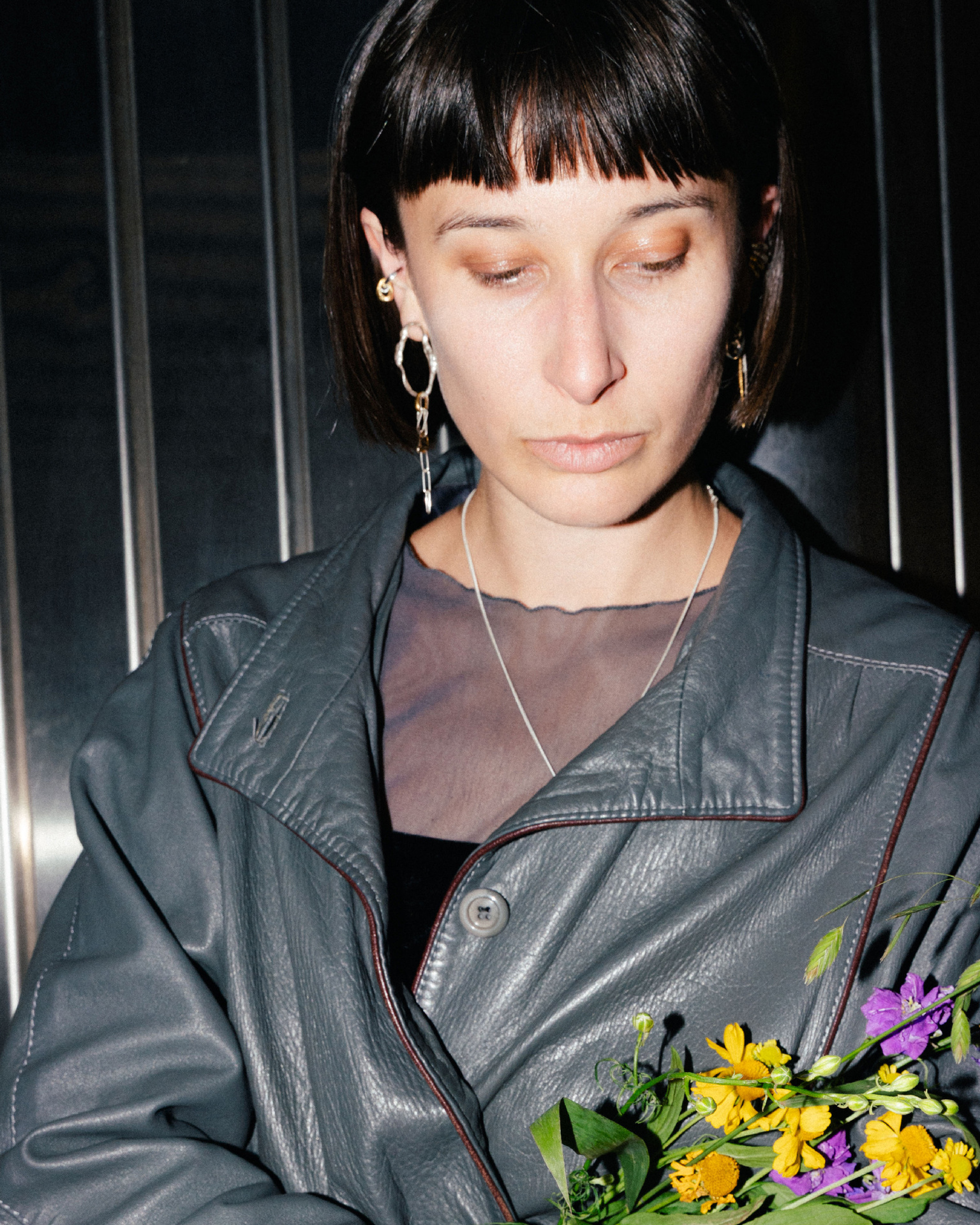 Fuyou long dangling earrings in silver with fluid oval shapes and gold plated details.