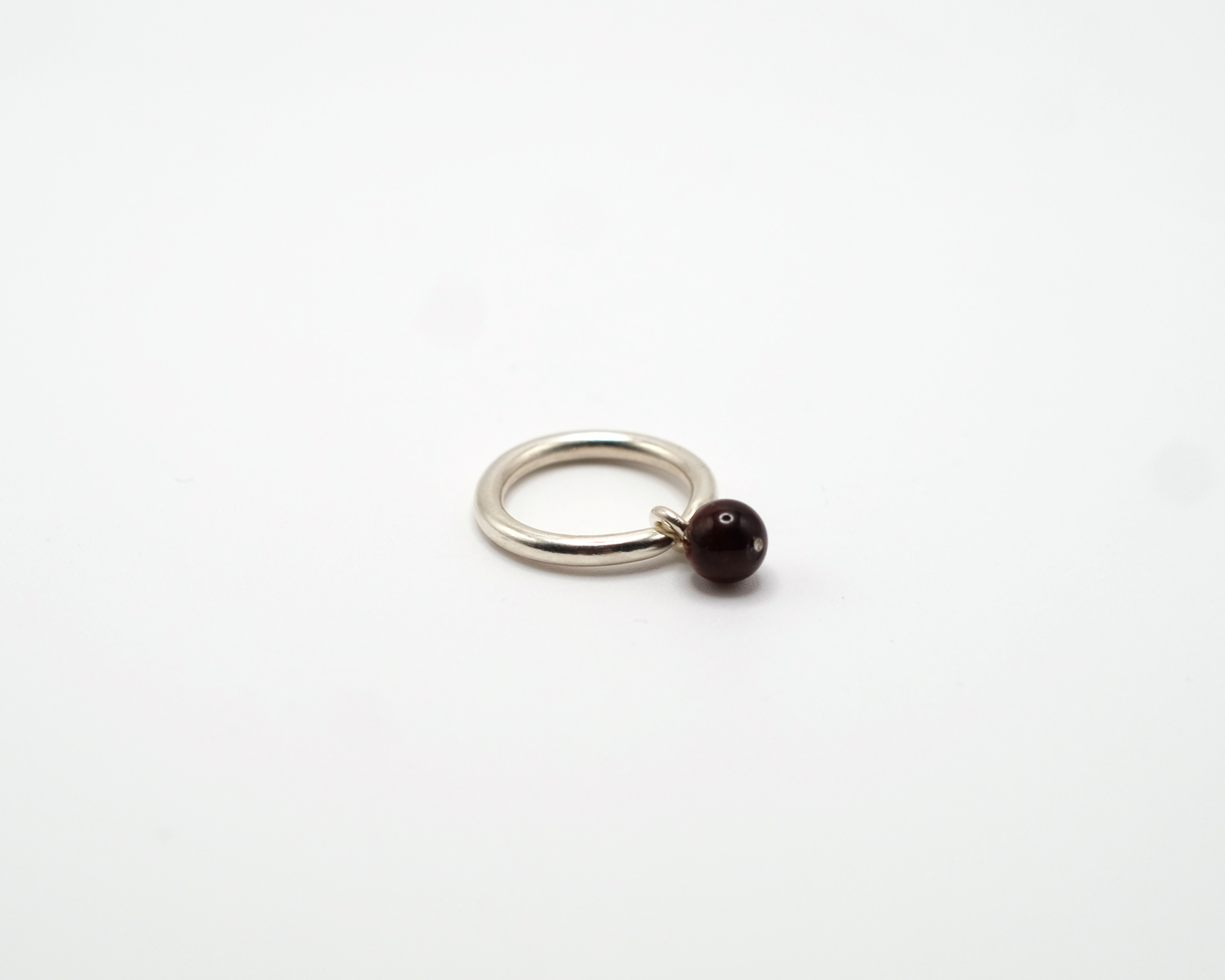 BoroBoro minimalist sterling silver ring with movable tiger eye bead.