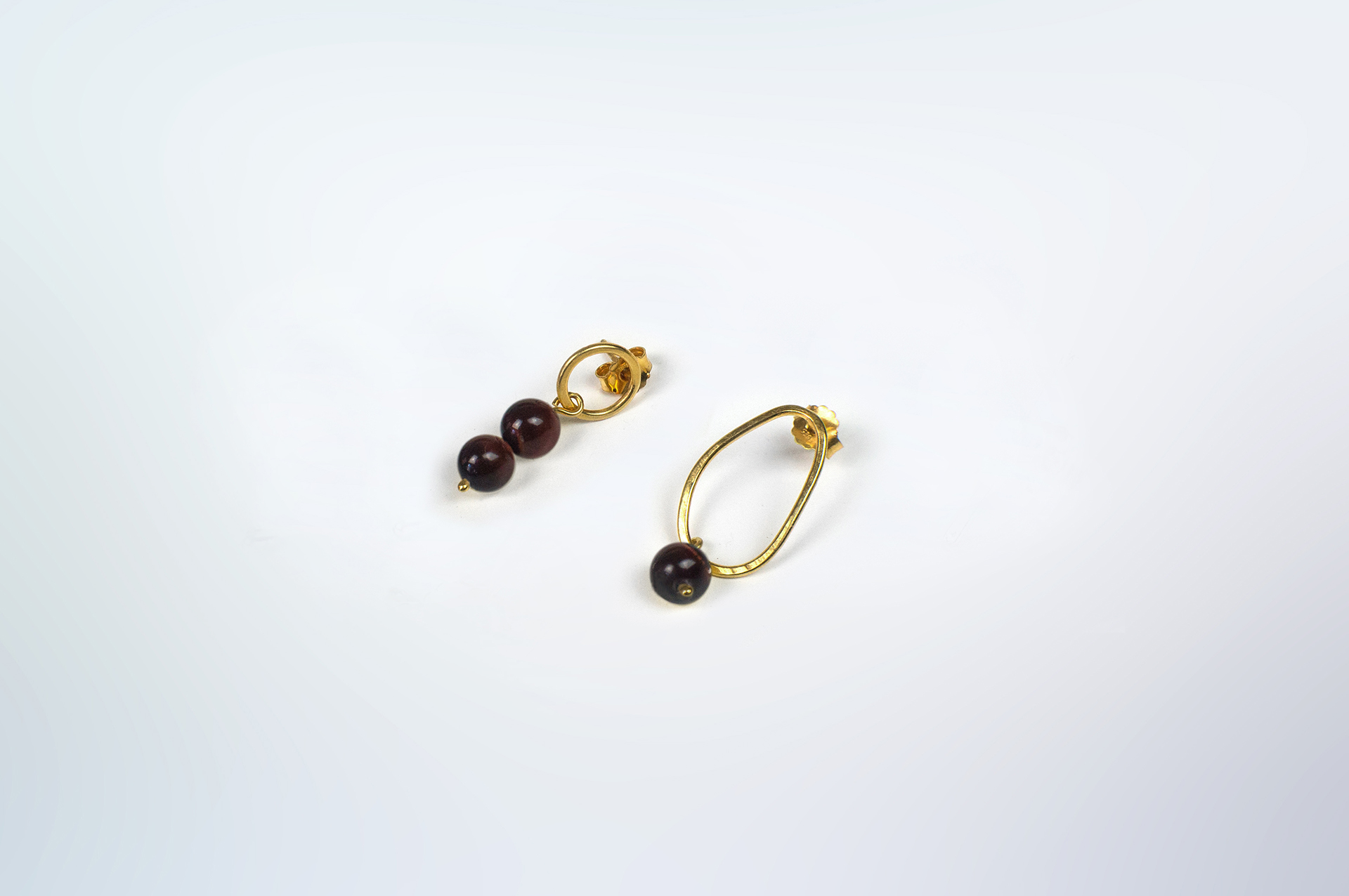 Boroboro asymmetrical gold plated bead earrings with tiger's eye.