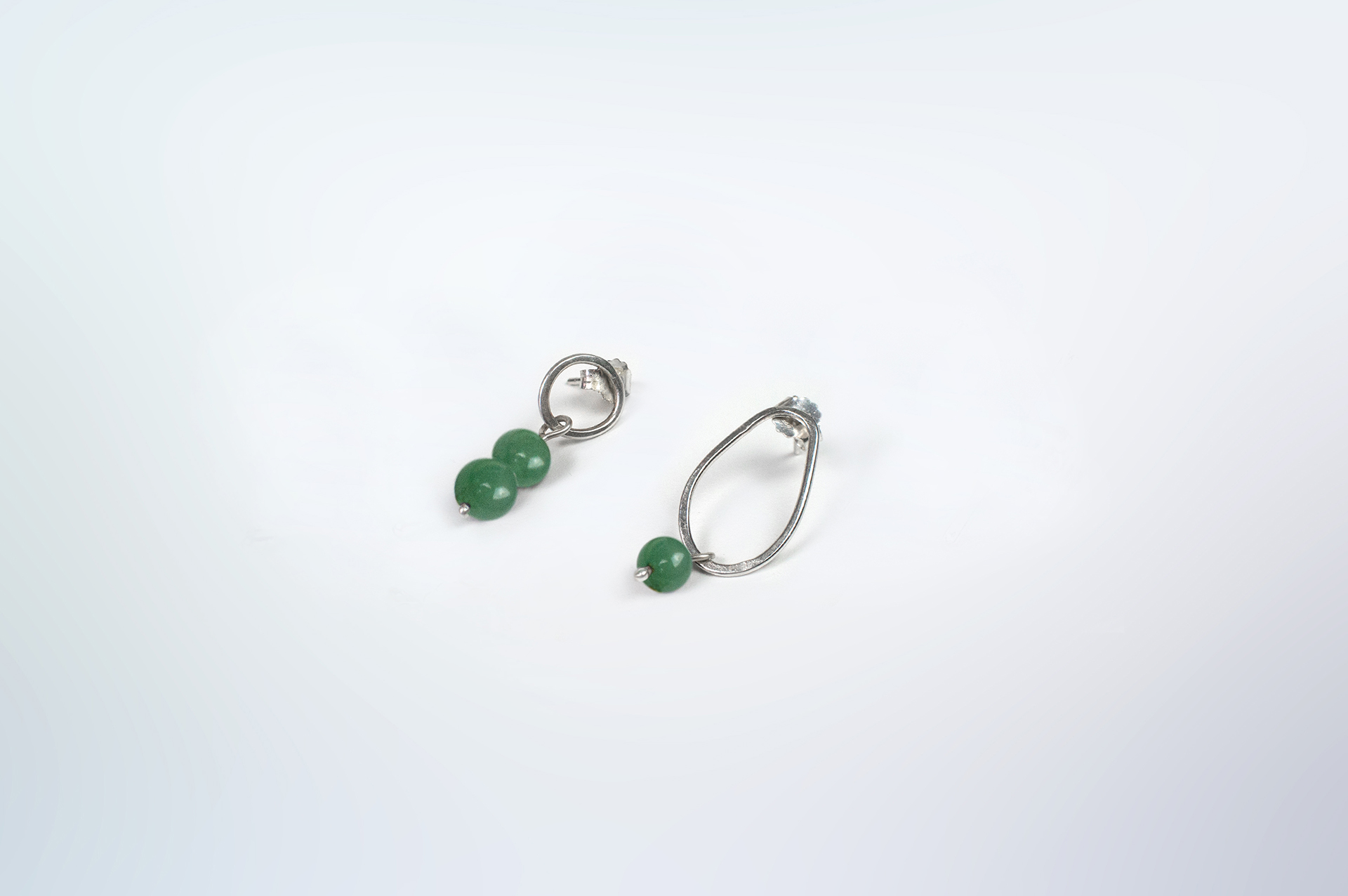 Boroboro asymmetrical silver bead earrings with green aventurine.