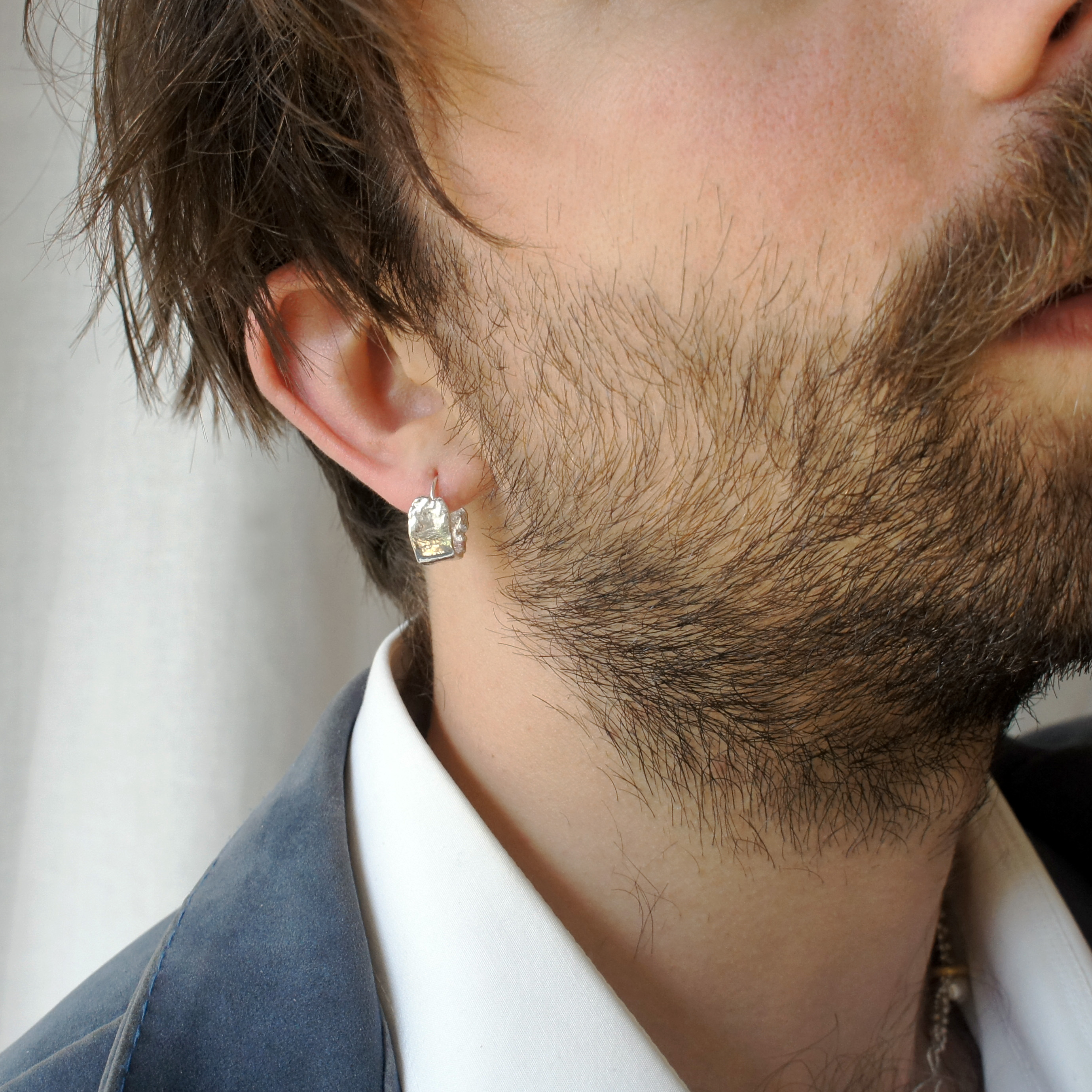 Kara small textured silver hoops.