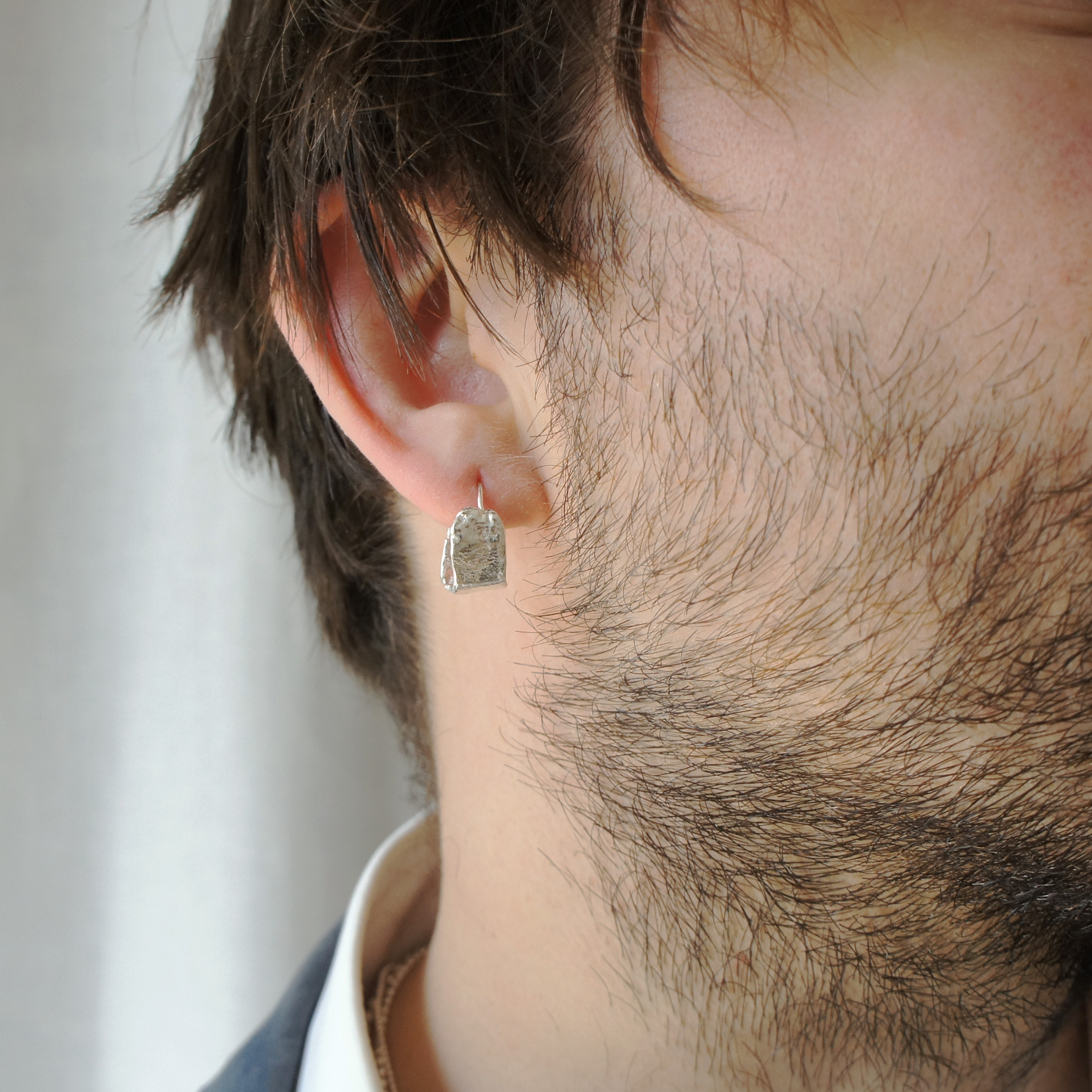 Kara small textured silver hoops.