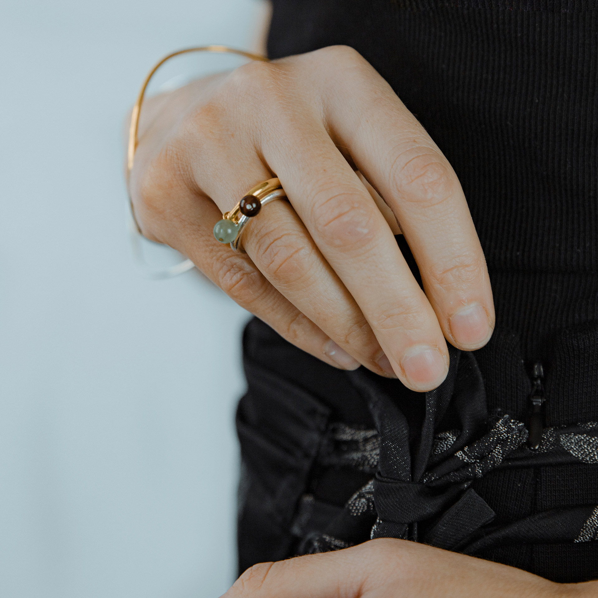 BoroBoro minimalist silver ring with movable tiger's eye bead.