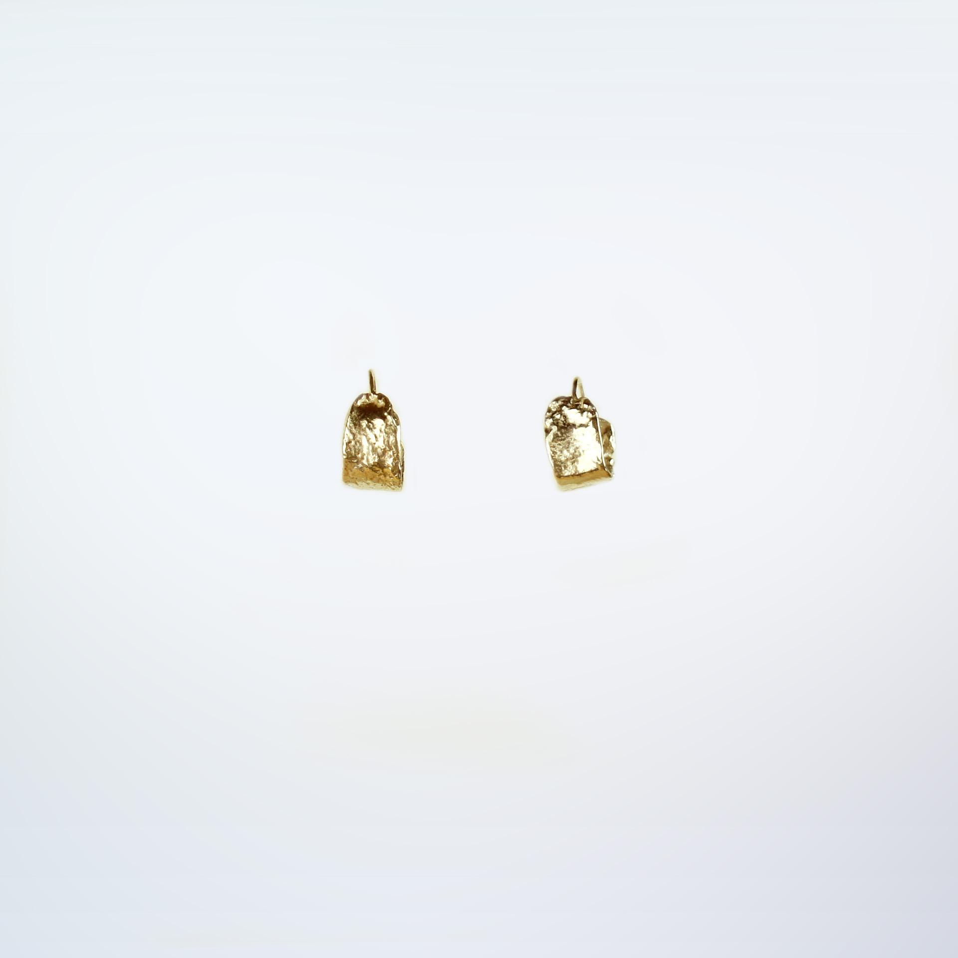 Kara small textured gold plated silver hoops.