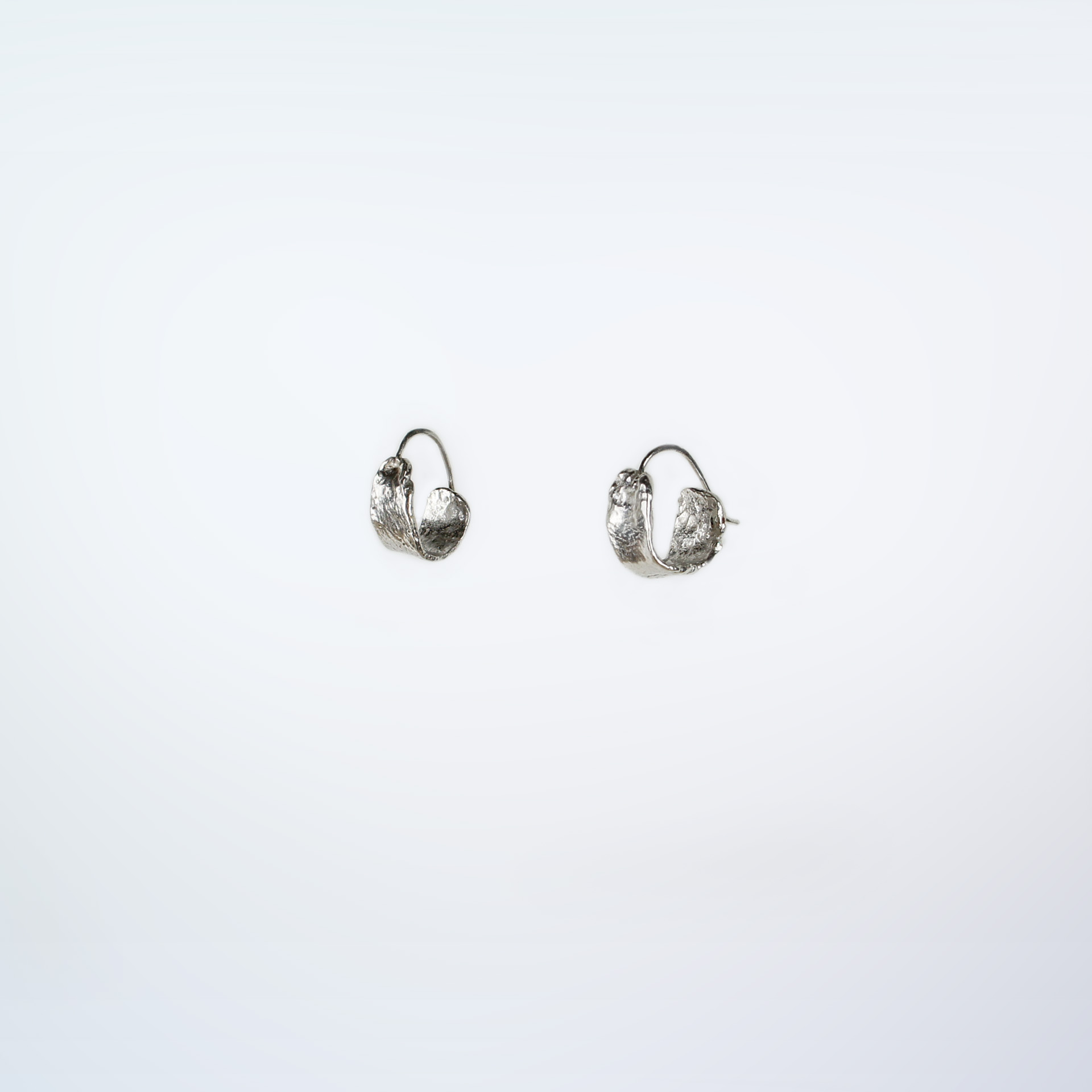 Kara small textured sterling silver hoops.