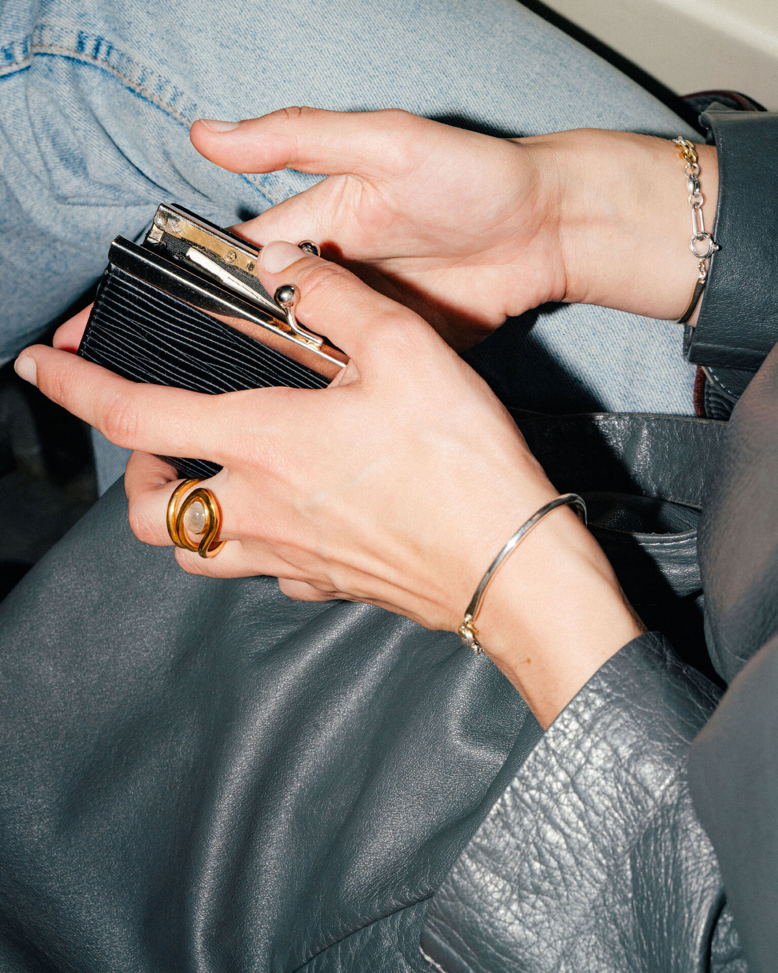 Uteki swirling ring with a prehnite oval stone. In gold plated silver.