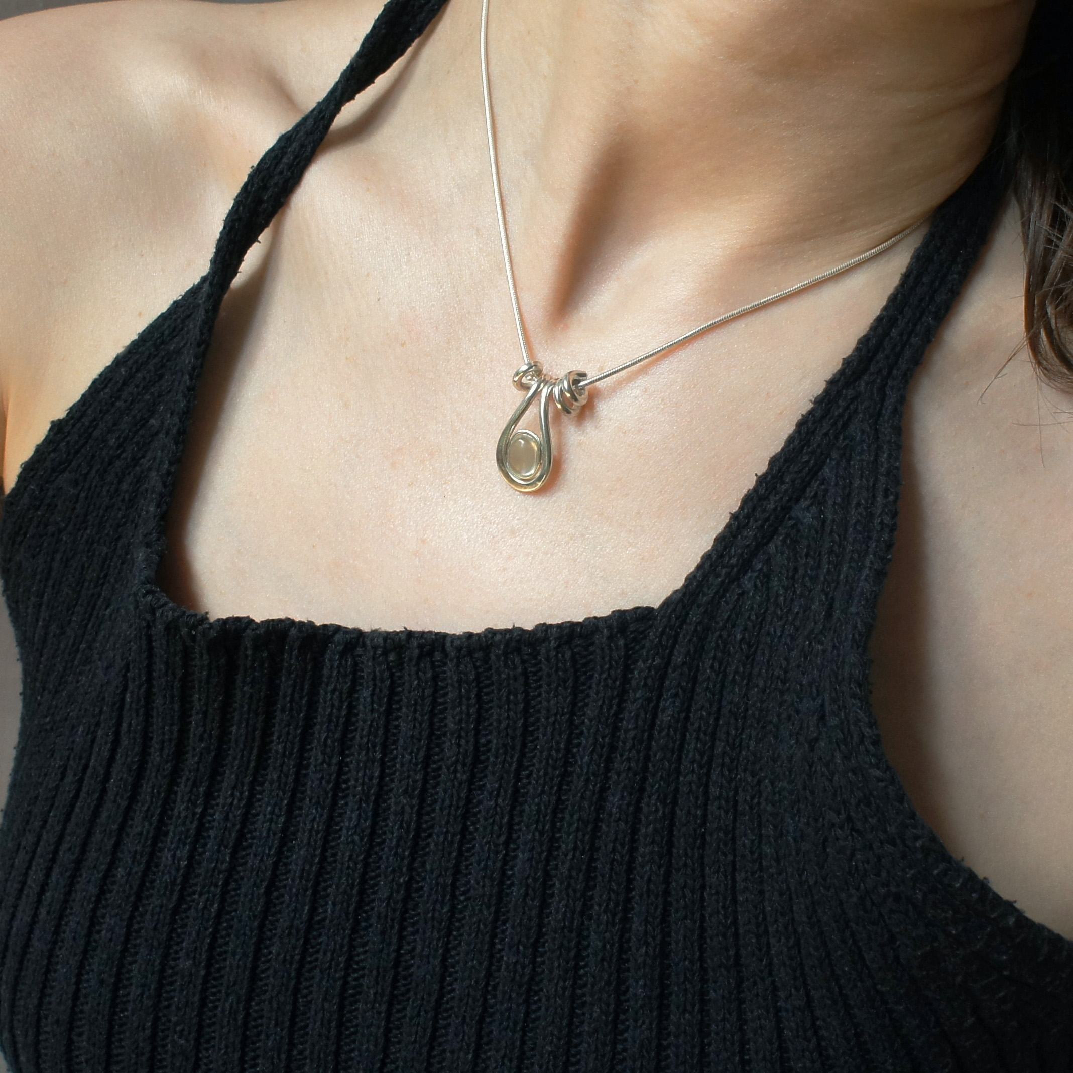 Uteki necklace with a droplet pendant and prehnite oval stone. Silver version