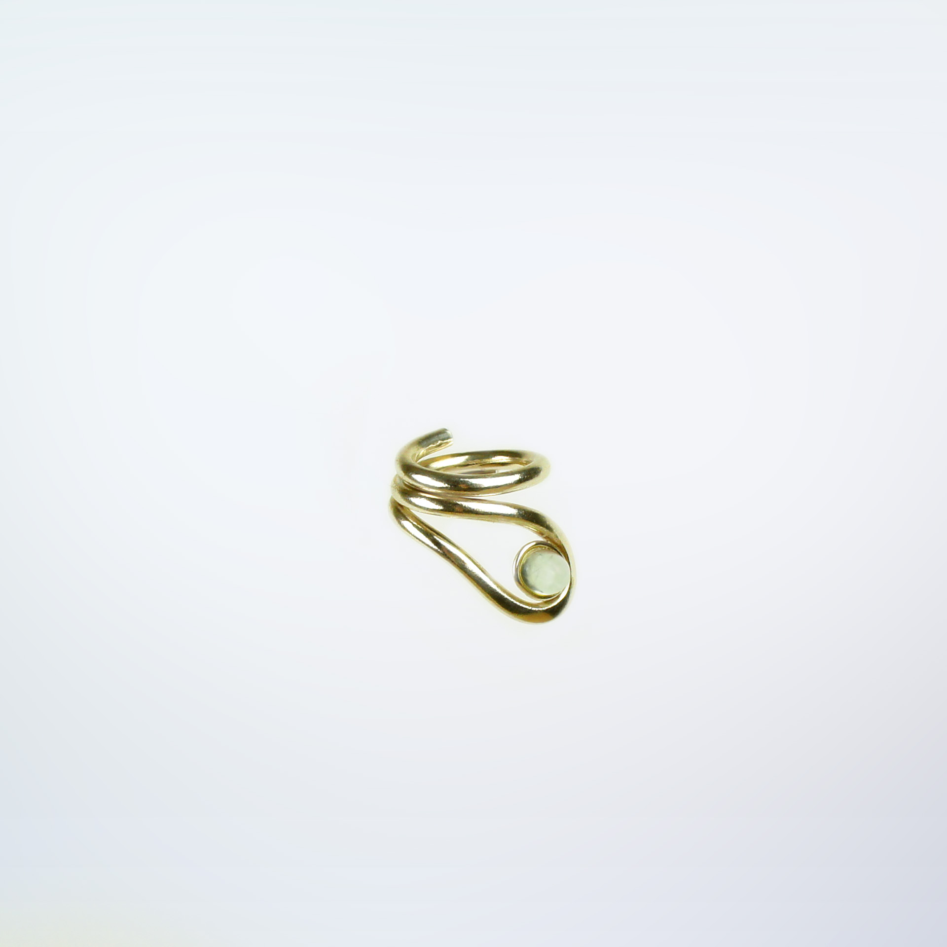 Uteki swirling ring with a prehnite oval stone. In gold plated sterling silver