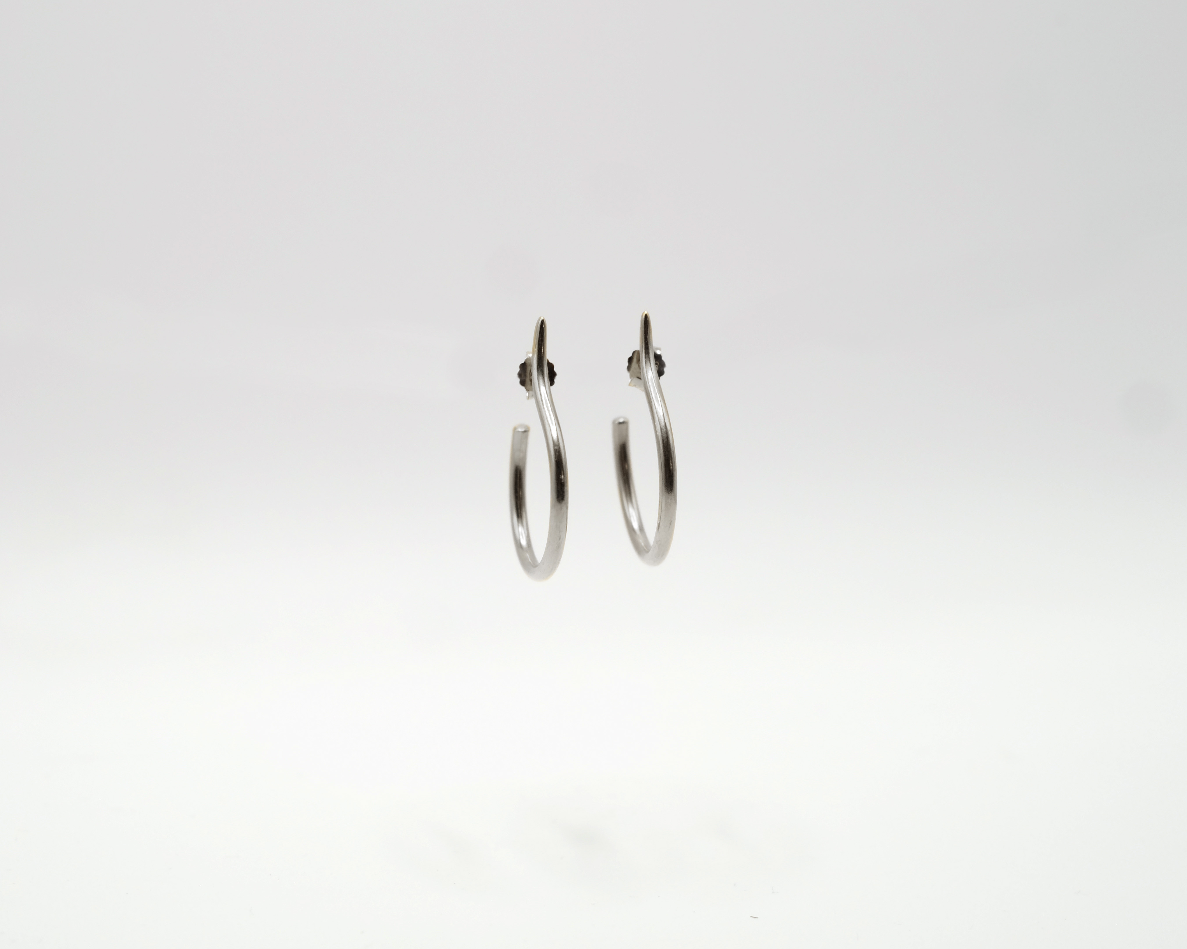 Mugura minimalist sterling silver hoops.