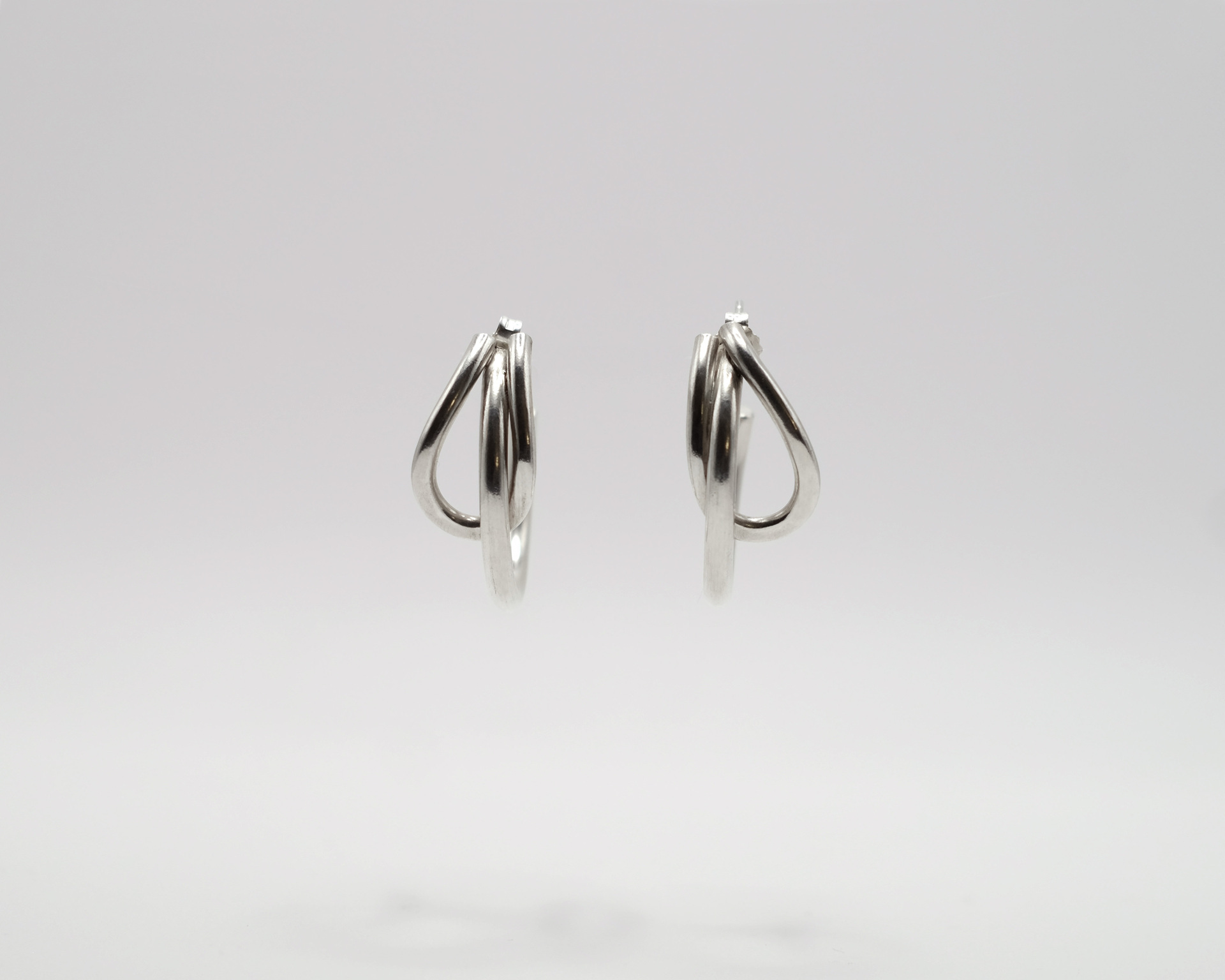 Uteki hoops with intertwined silver wire.