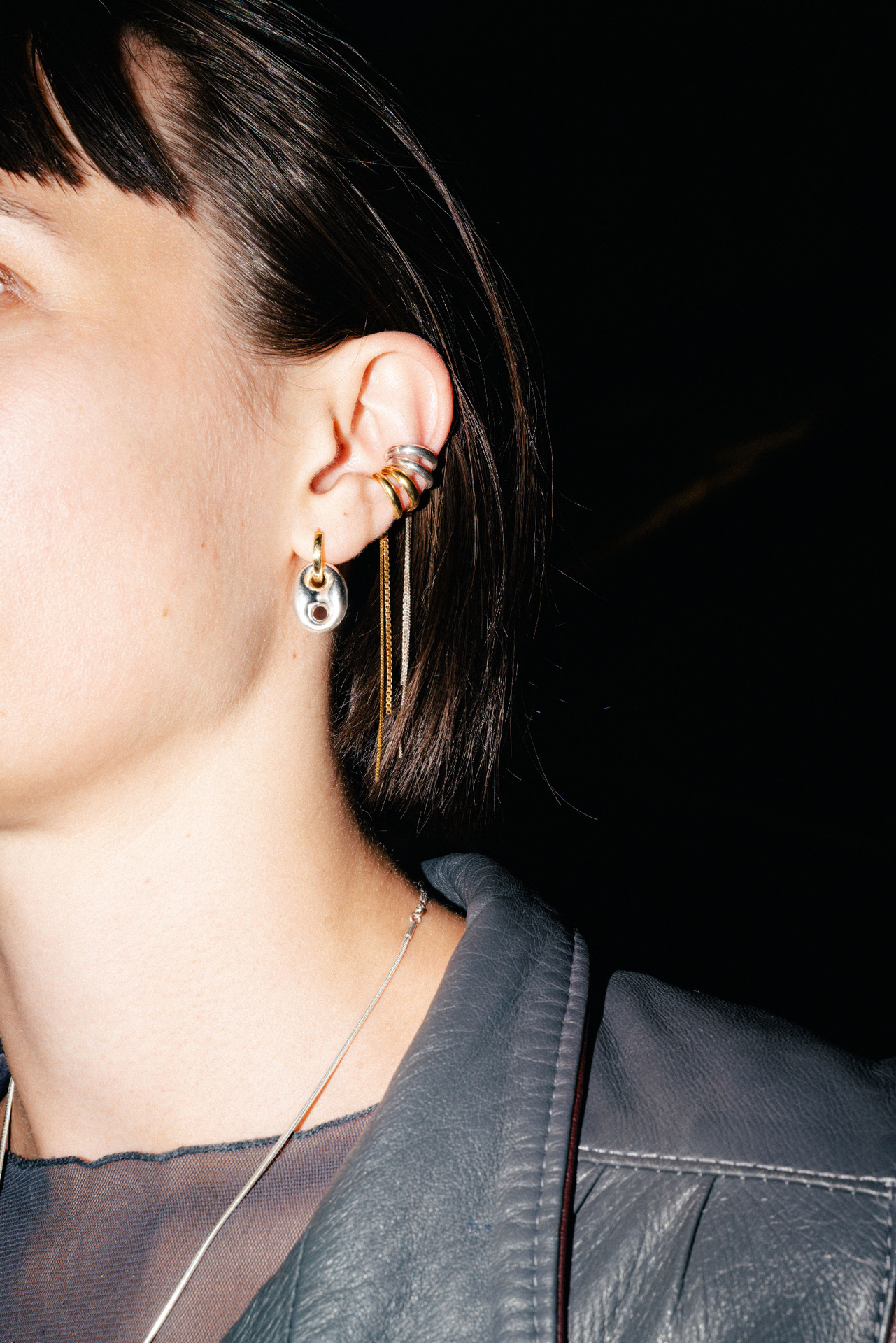 Tamanori ear cuff in sterling silver with dangling chains.