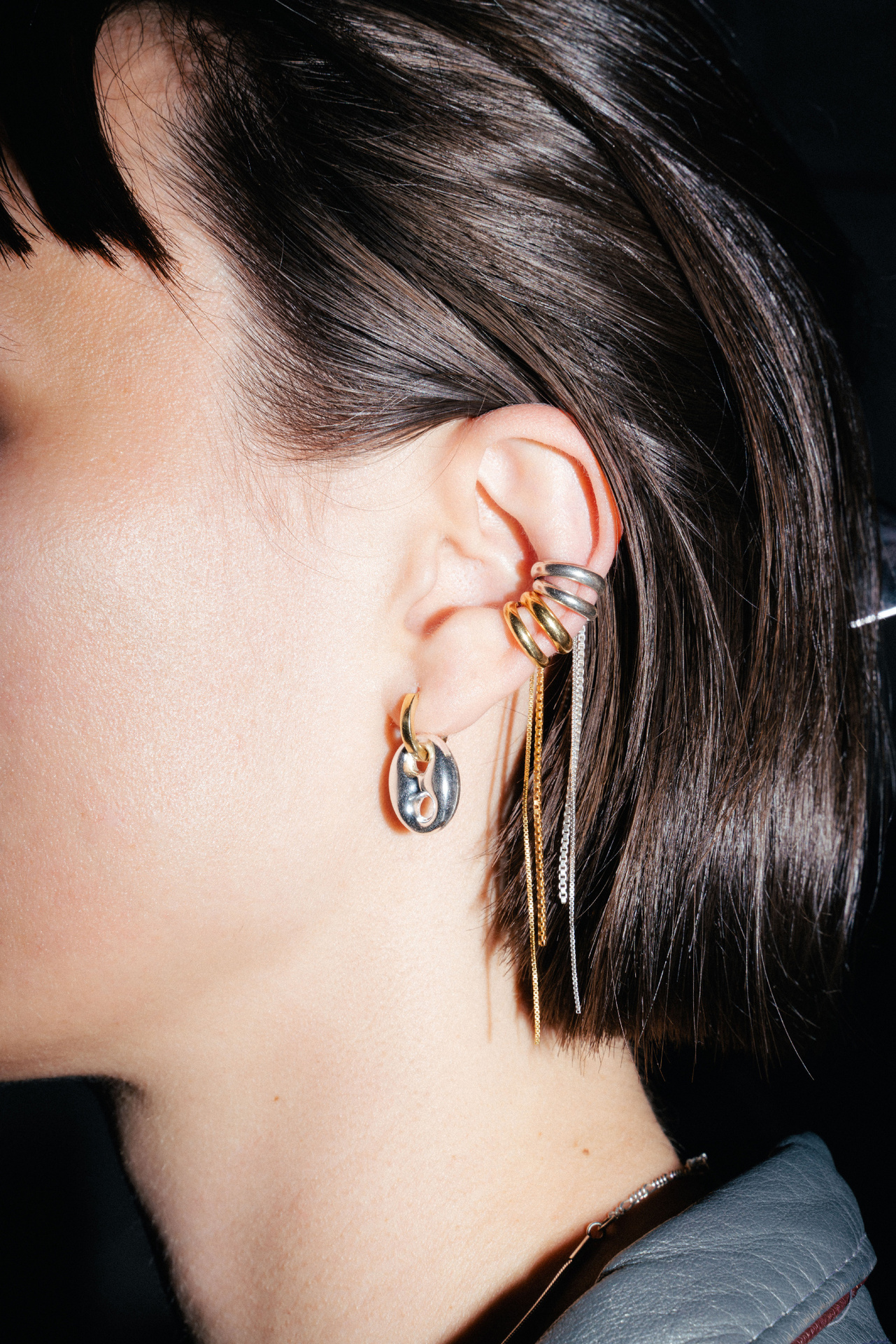 Tamanori ear cuff in gold plated silver with dangling chains.