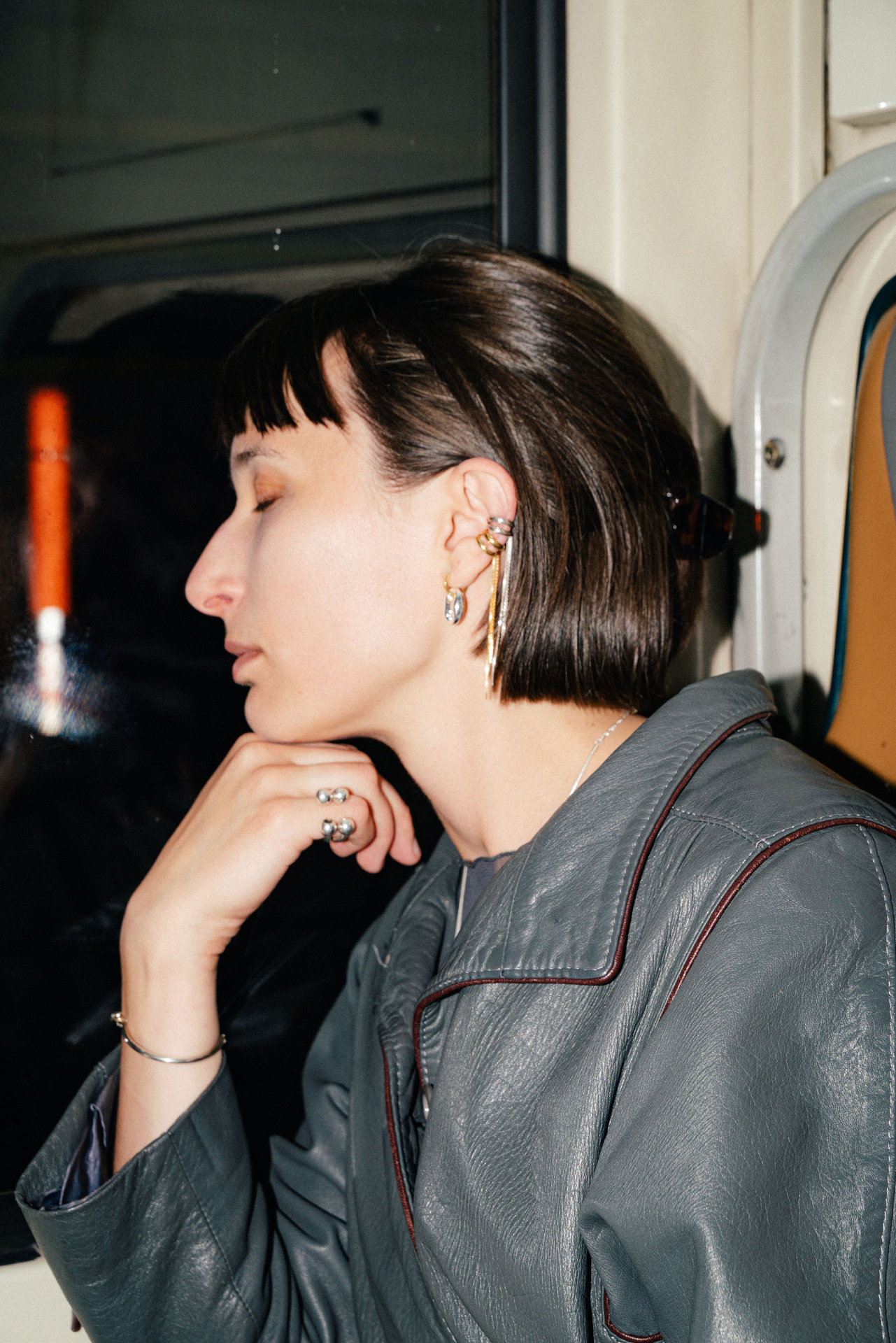 Tamanori ear cuff in gold plated silver with dangling chains.