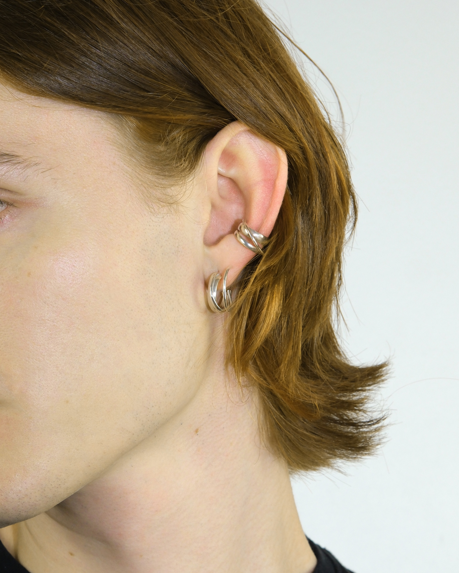 Hattari small crossed hoops in sterling silver.