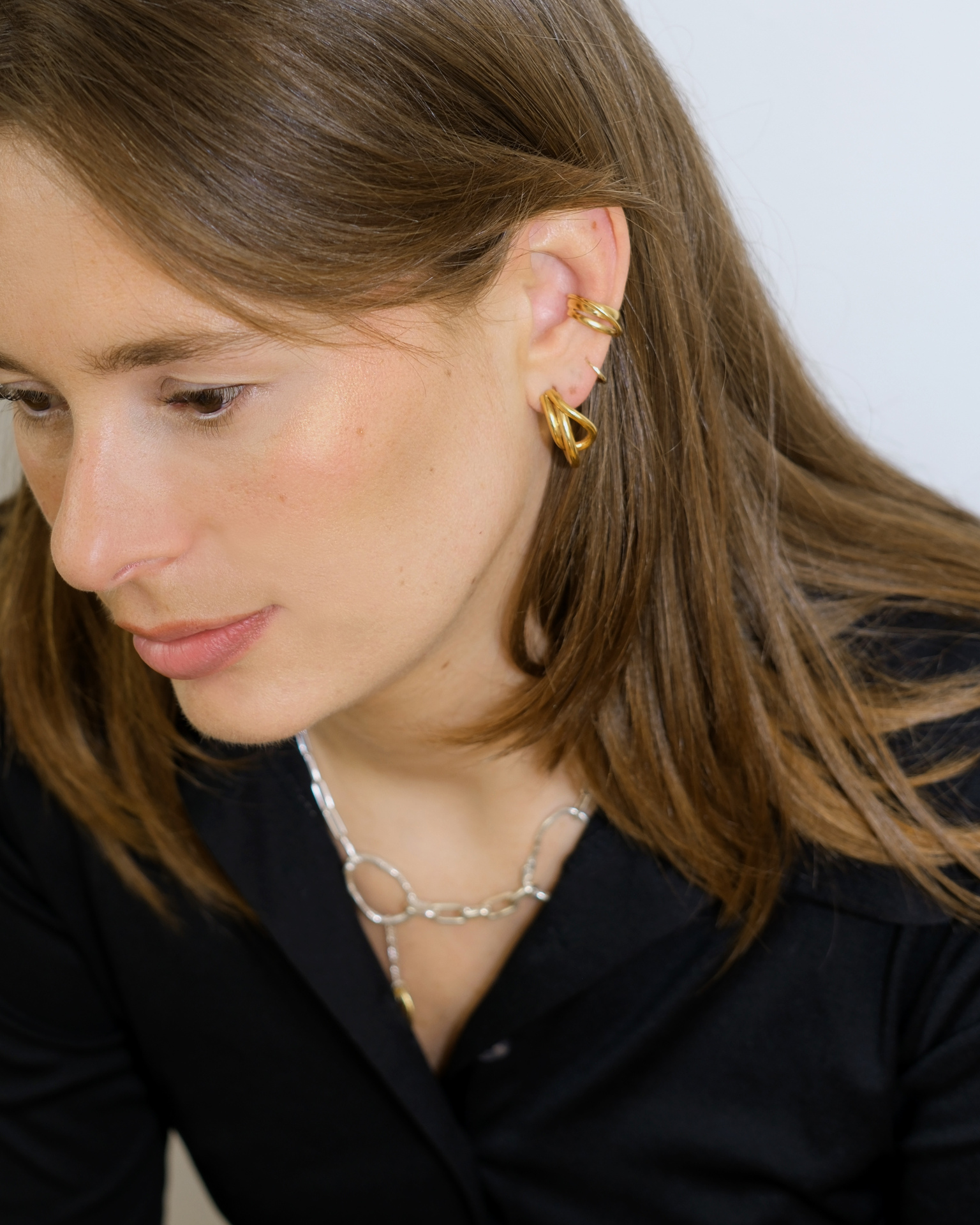 Hattari ear cuff with intertwined gold plated wires.