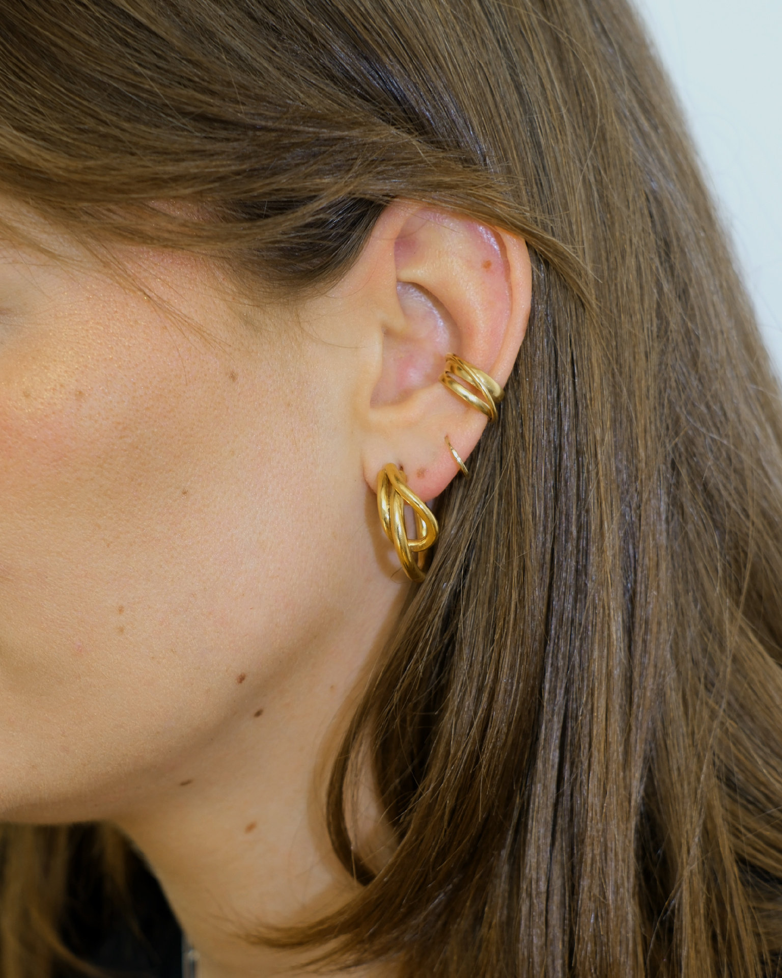 Hattari ear cuff with intertwined gold plated wires.