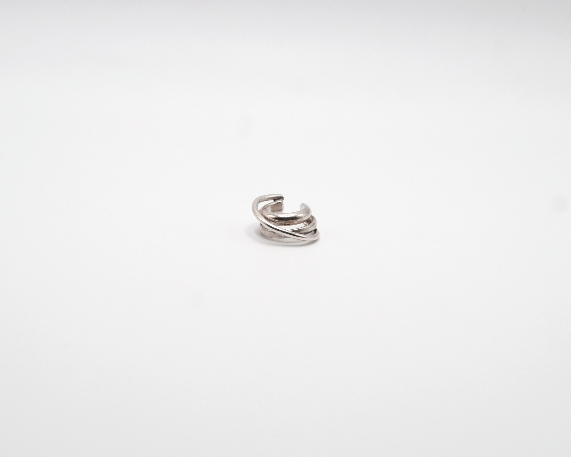 Hattari ear cuff with intertwined silver wires.